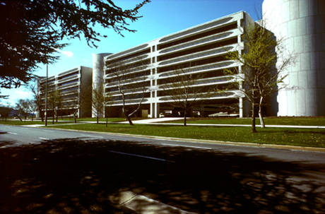 Facade with long-span precast beams
