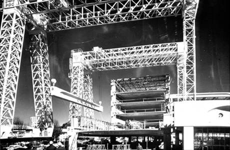Moveable gantries lifting precast facade and floor elements